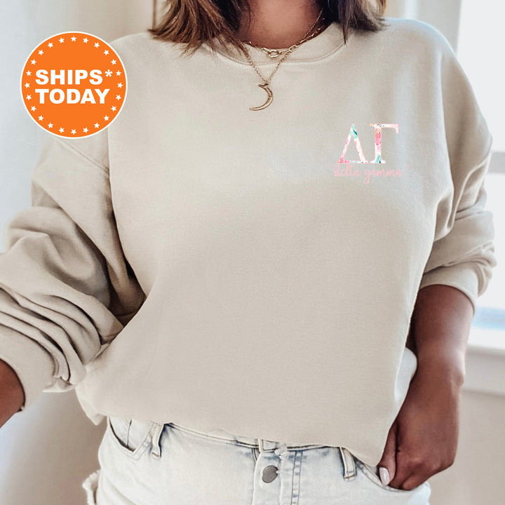 a woman wearing a sweatshirt with a pink logo on it