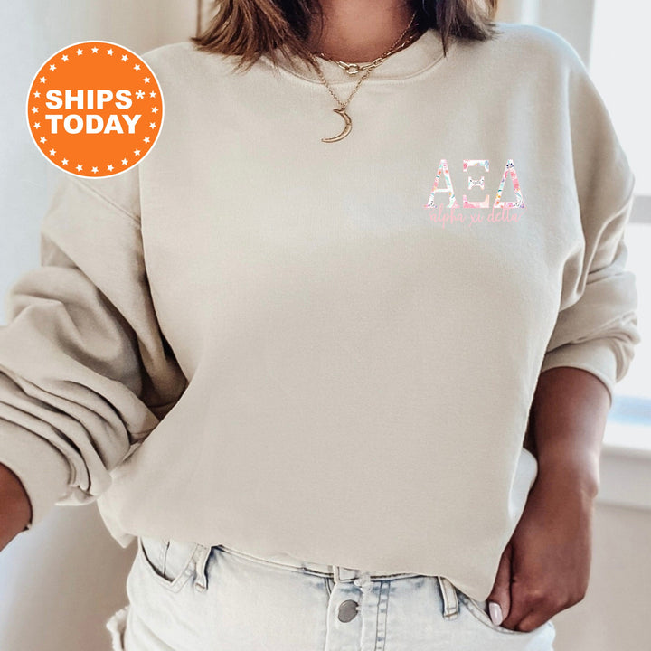 a woman wearing a white sweatshirt with a pink logo on it