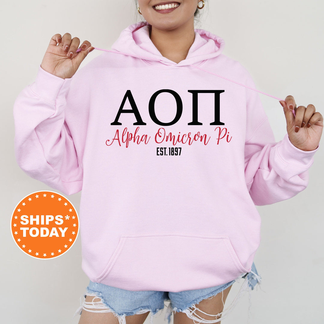 a woman wearing a pink hoodie with the word aoi on it