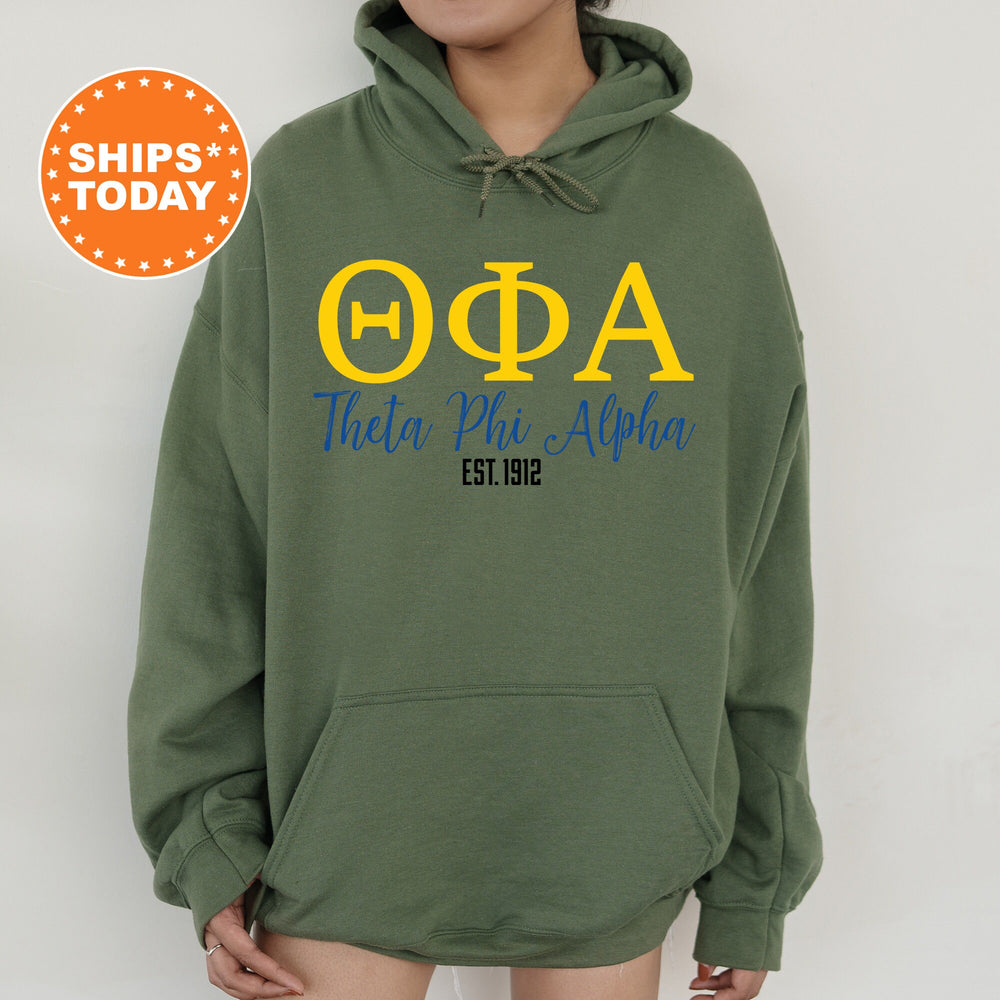 a woman wearing a green hoodie with the words ooa on it