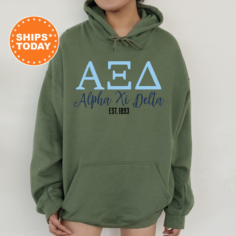 a person wearing a green hoodie with the aea logo on it