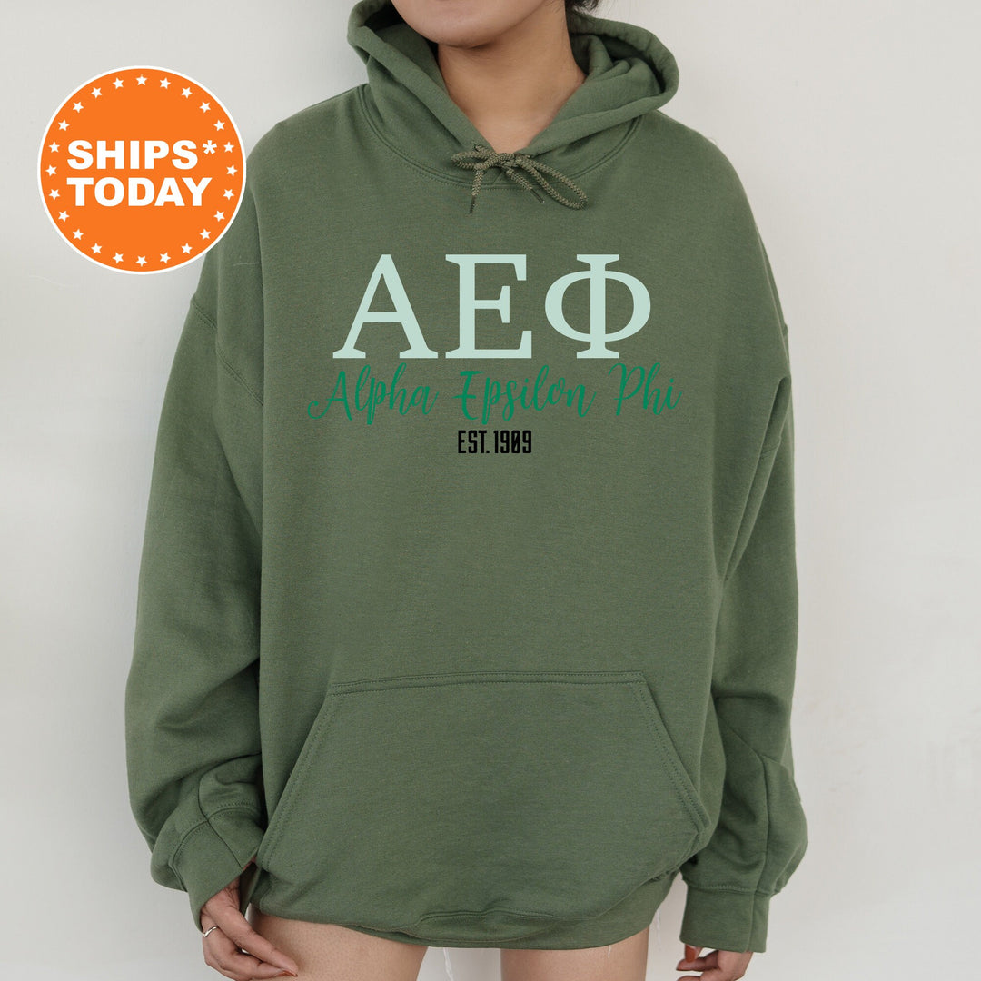 a person wearing a green hoodie with the words aep on it