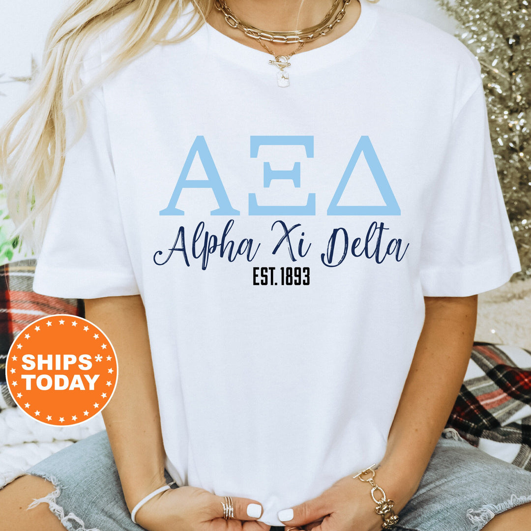 a woman wearing a white aea shirt with blue letters