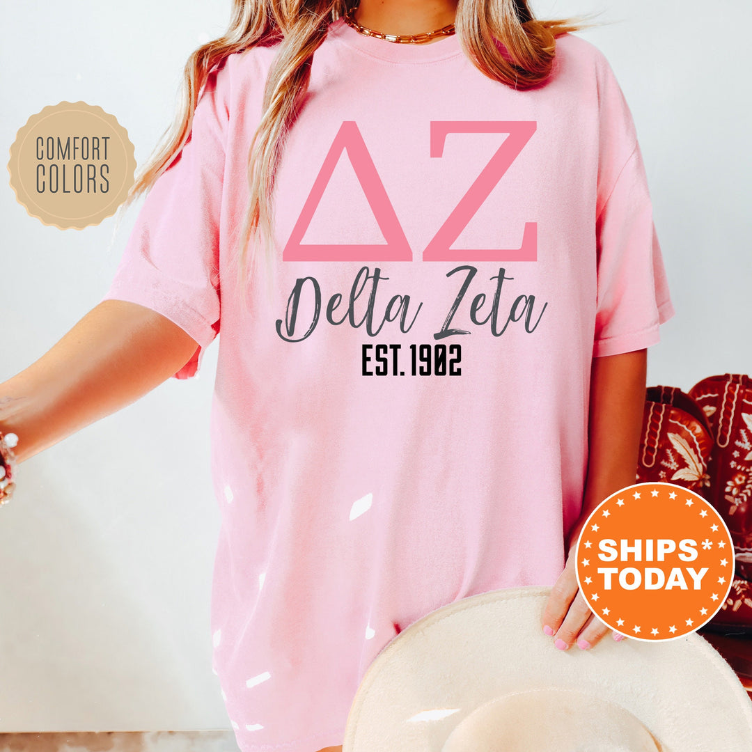 a woman wearing a pink delta delta shirt