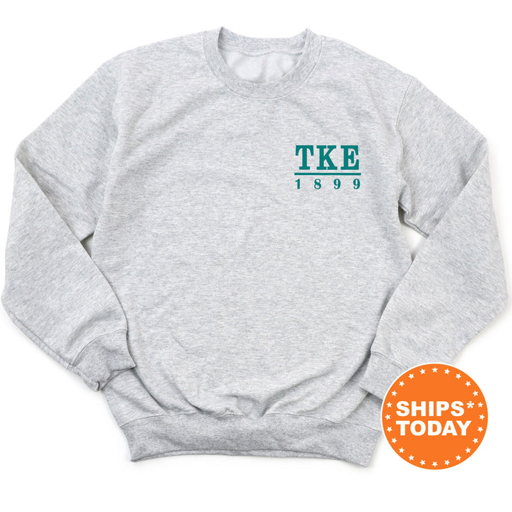 a grey sweatshirt with the words tke printed on it