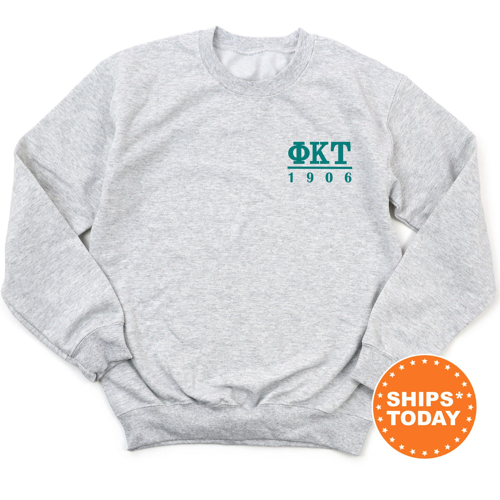 a grey sweatshirt with the words okt on it