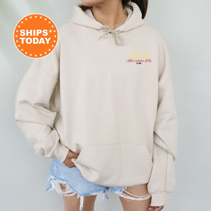 a woman wearing a white hoodie with the words atta on it