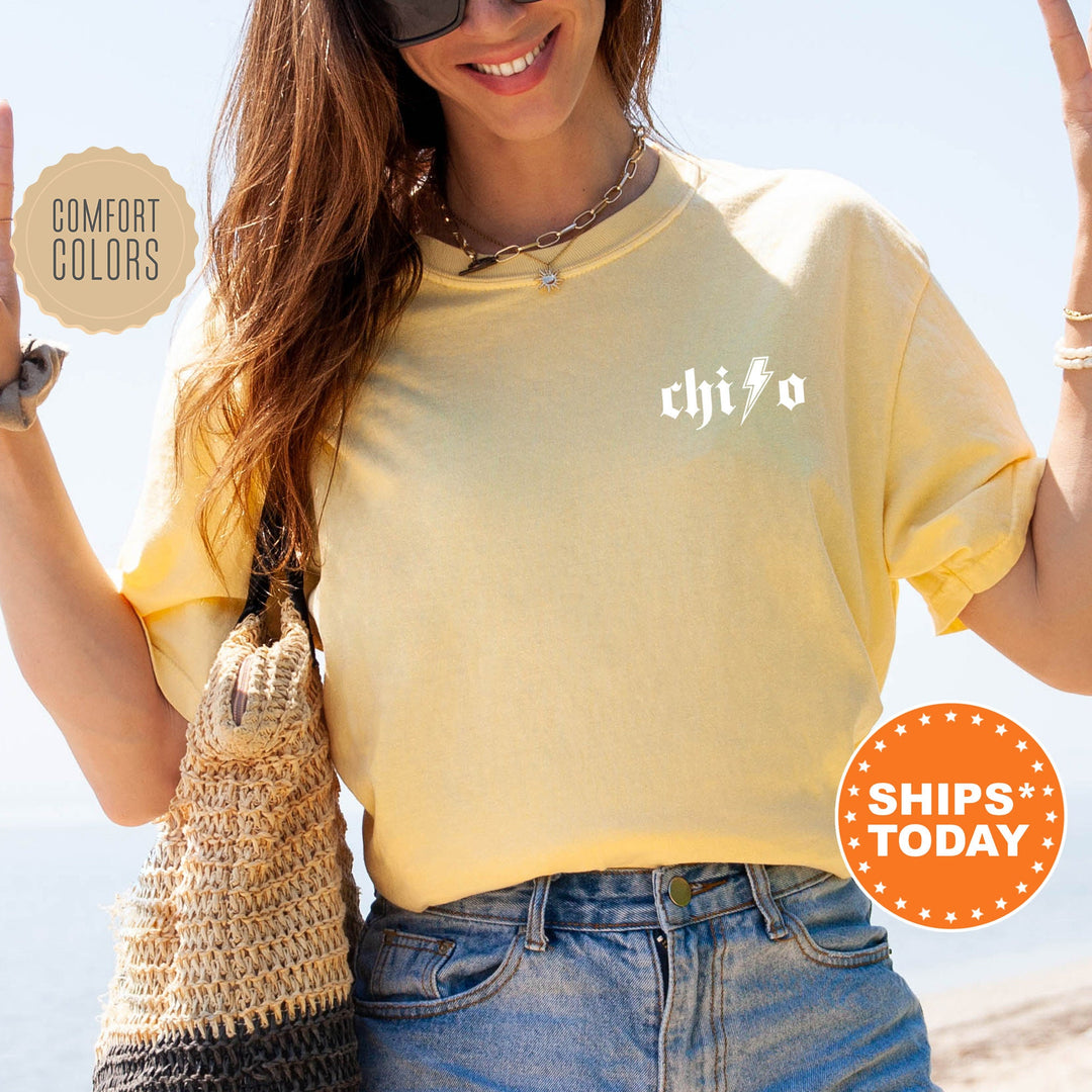 a woman in a yellow shirt holding up a peace sign