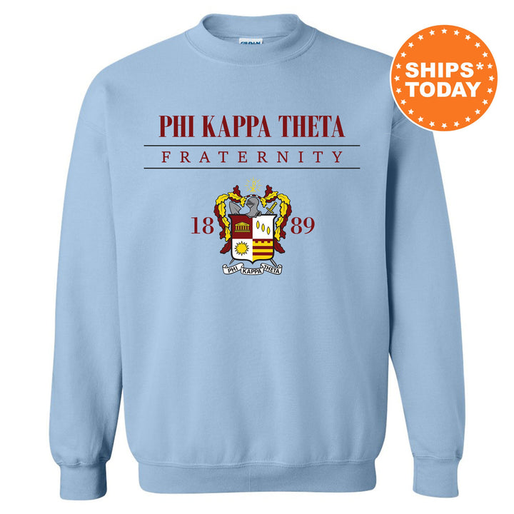 a light blue sweatshirt with the phi kapaa thoa fraternity on it