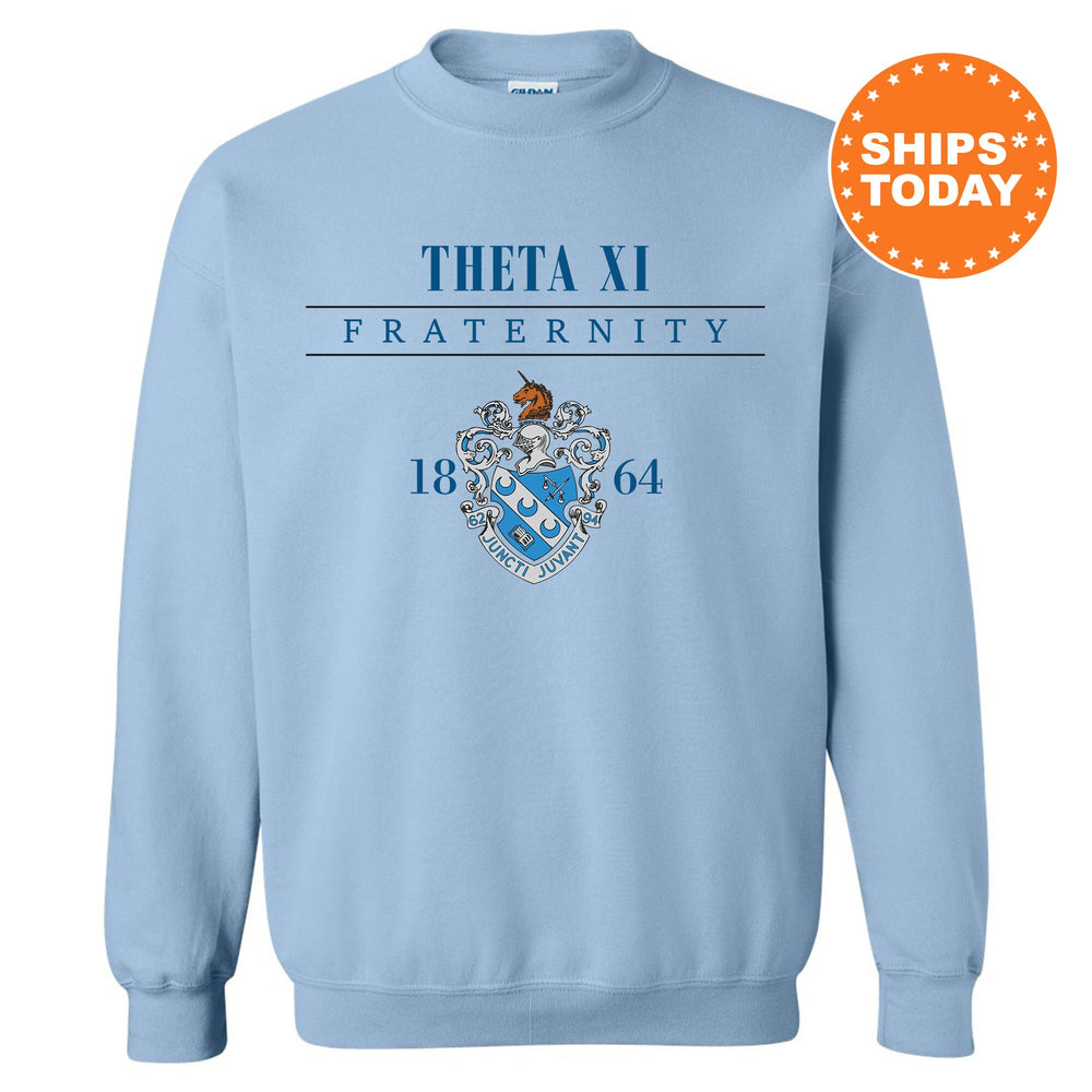 a light blue sweatshirt with the fraternity crest on it