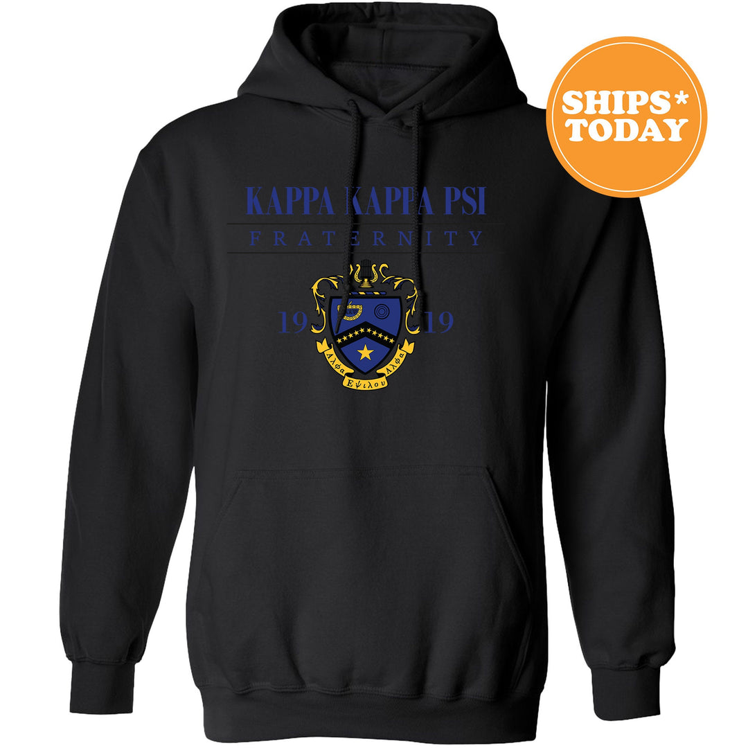 a black hoodie with a blue and yellow crest on it