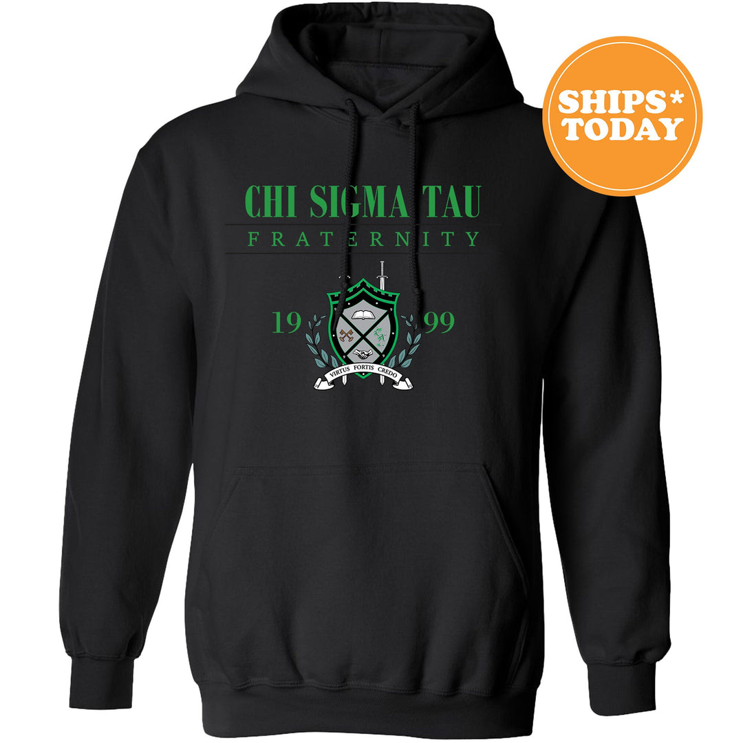 a black hoodie with a green and white crest on it