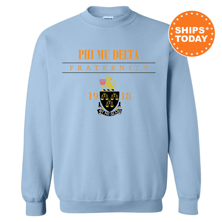 a light blue sweatshirt with phi me delta fraternity on it