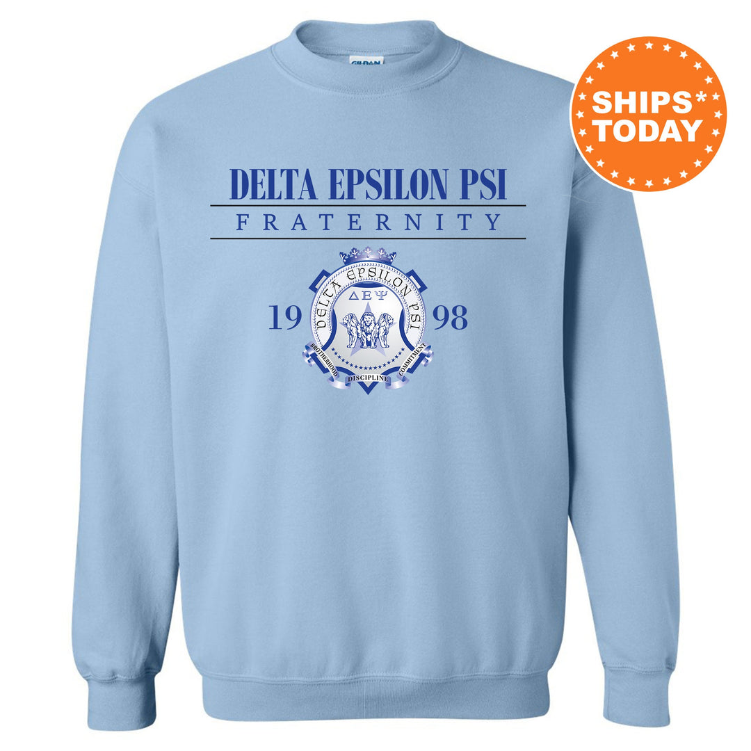 a light blue sweatshirt with the delta emblem on it