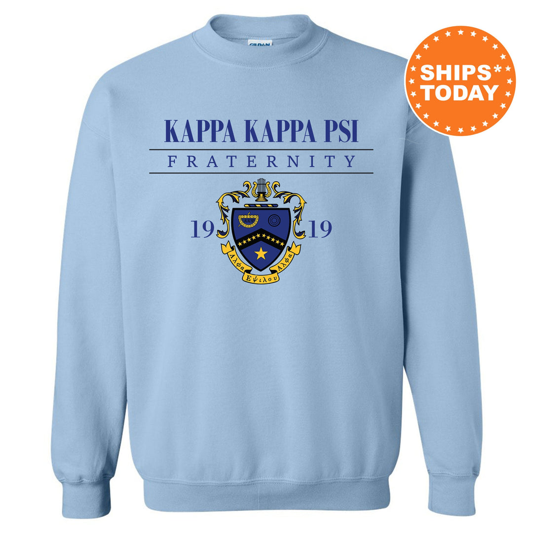 a light blue sweatshirt with the words kapa kapa pi fraternity on it