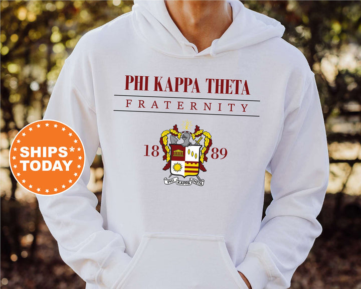a person wearing a white hoodie with phi kapa thoea fraternity on it