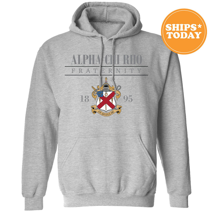 a grey hoodie with a flag and a coat of arms on it