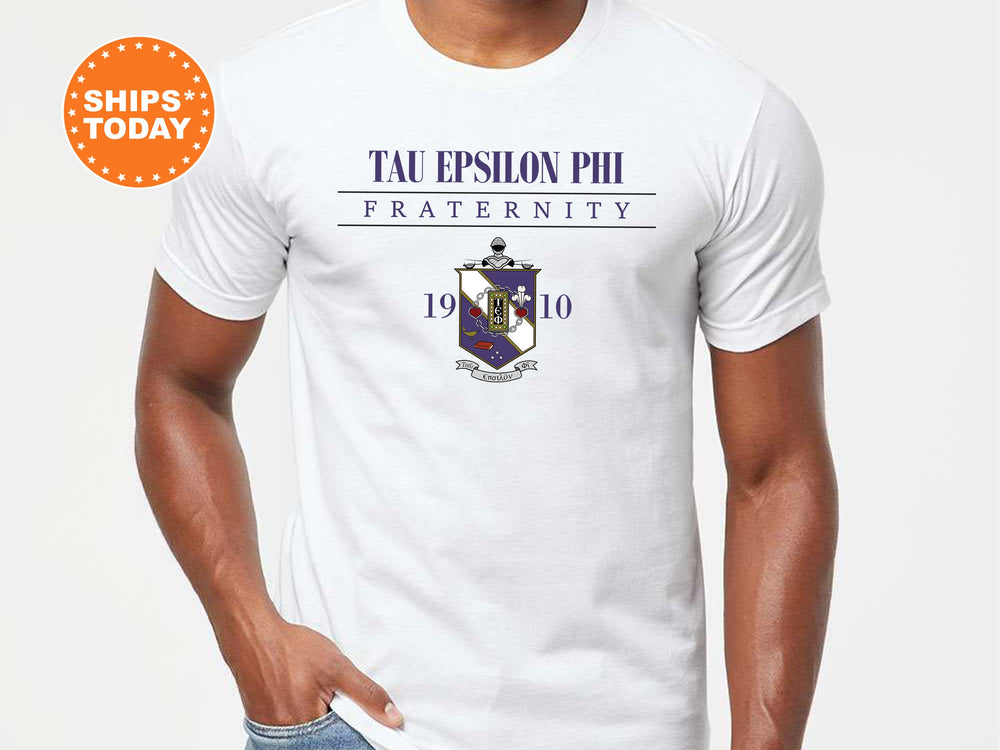 a man wearing a white t - shirt with the words tau epson pi fraternity