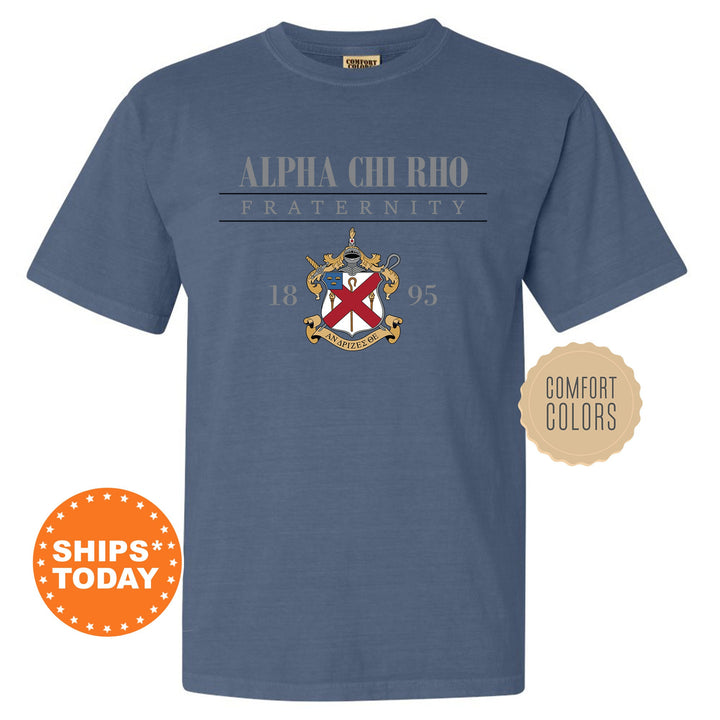 a blue t - shirt with a crest and the words, alpha chiero fraternity