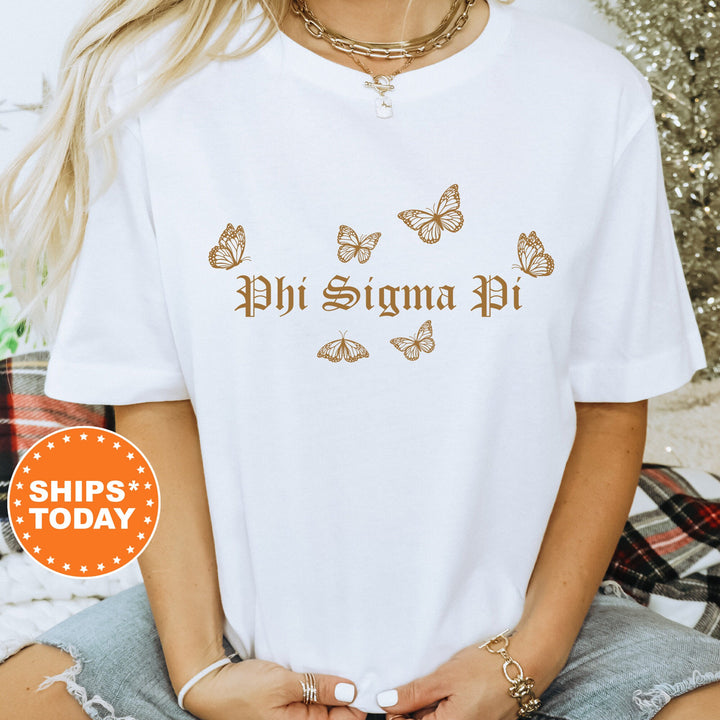 a woman wearing a white shirt that says phi stigma pi