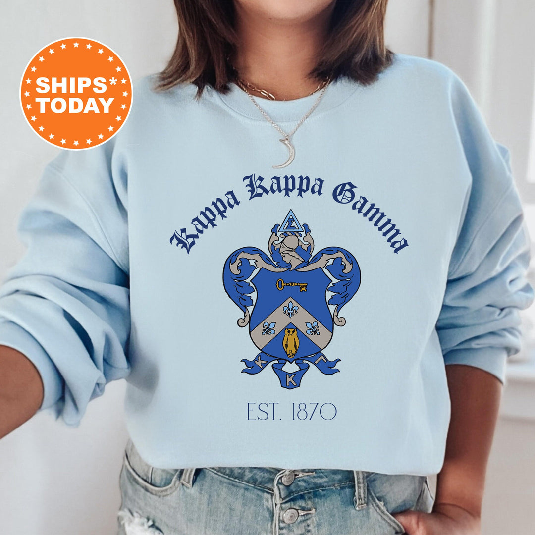 a woman wearing a blue sweatshirt with a crest on it