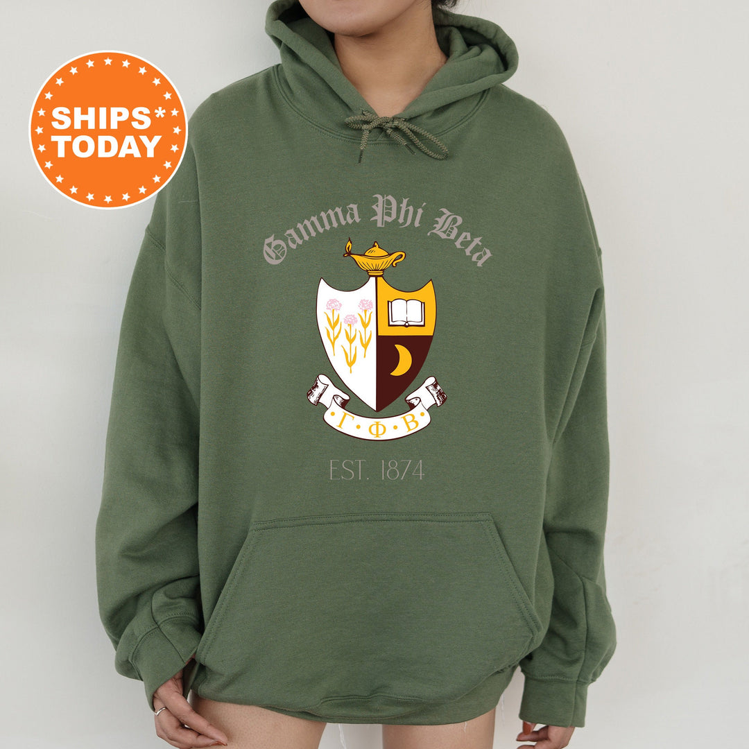 a woman wearing a green hoodie with a crest on it
