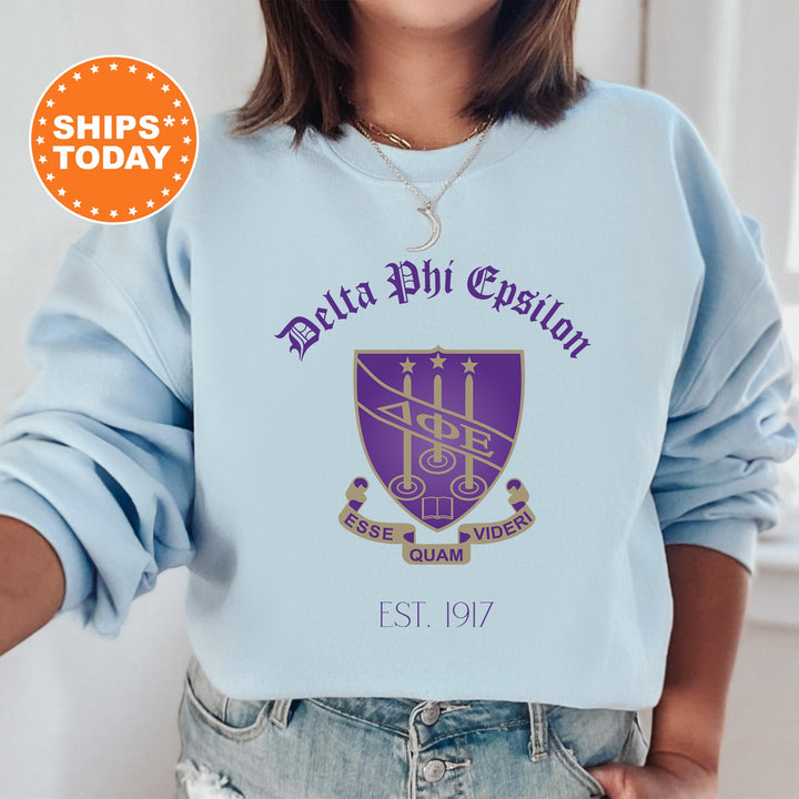 a woman wearing a sweatshirt with the delta phi phi phi phi phi phi phi phi
