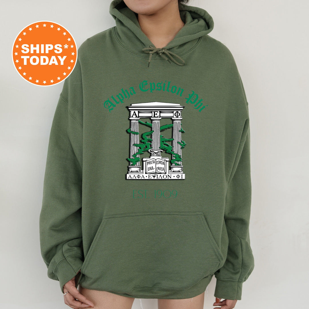 a person wearing a green hoodie with a picture of a building on it