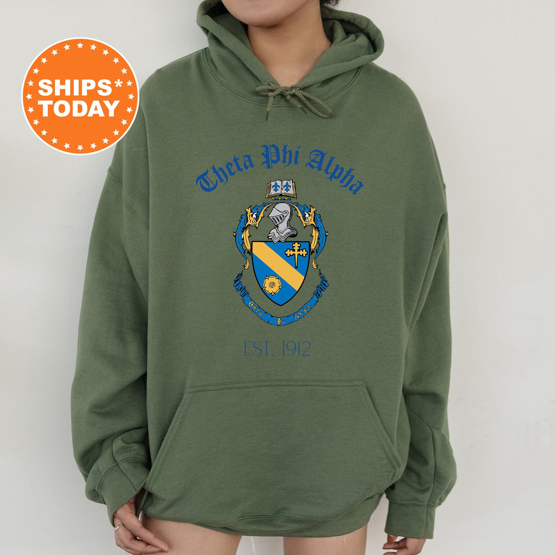 a person wearing a green hoodie with a blue and yellow crest on it