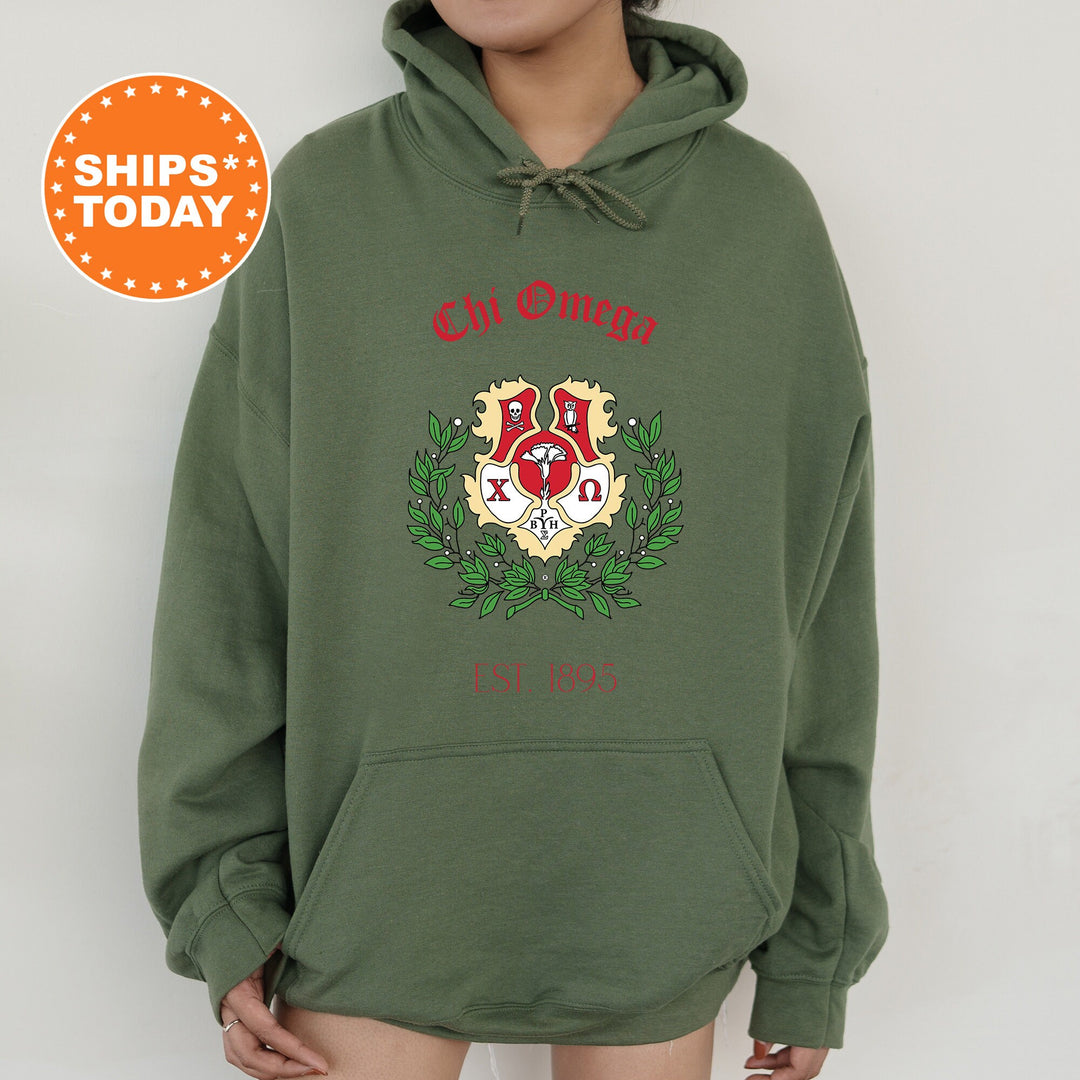 a person wearing a green hoodie with a red and white crest on it