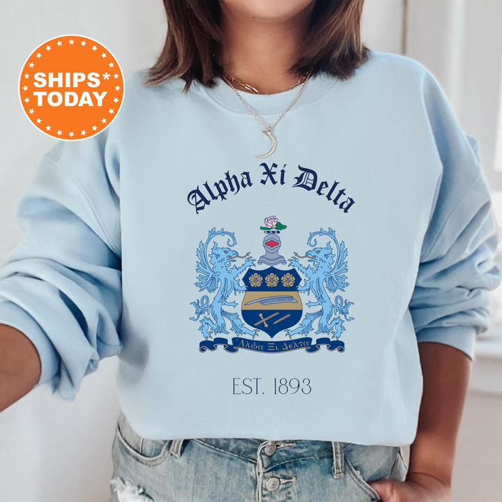 a woman wearing a blue sweatshirt with an image of a coat of arms