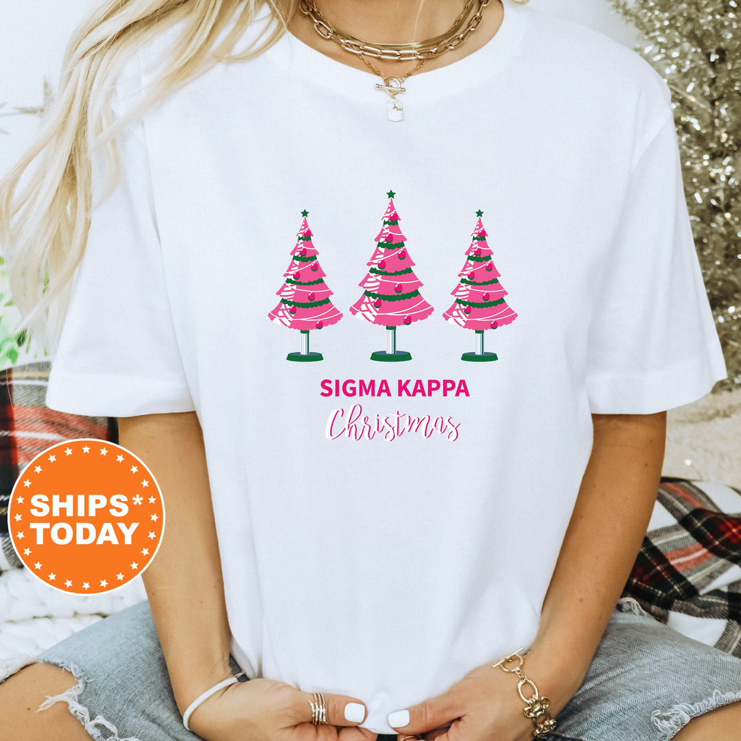 a woman wearing a white tshirt with christmas trees on it