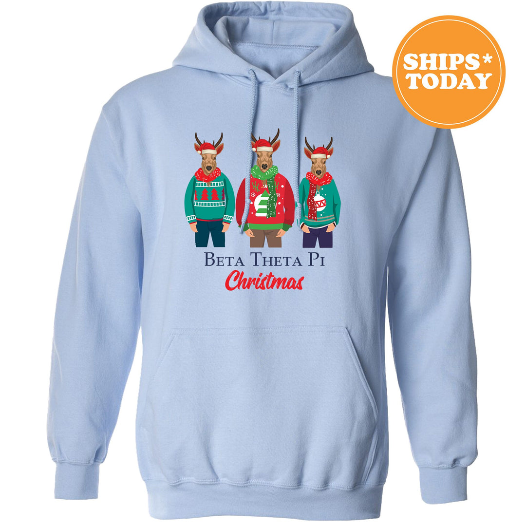 a light blue hoodie with three reindeers wearing ugly sweaters