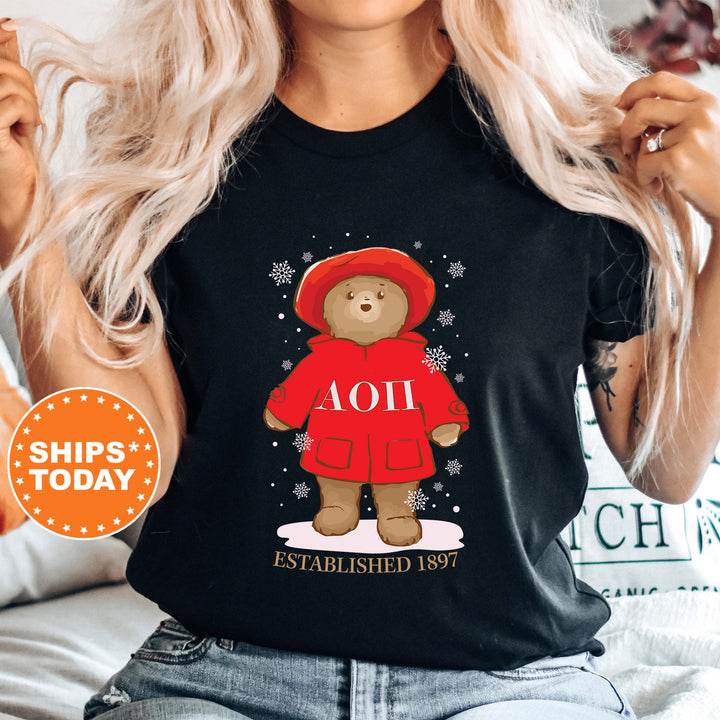 a woman wearing a black shirt with a bear on it