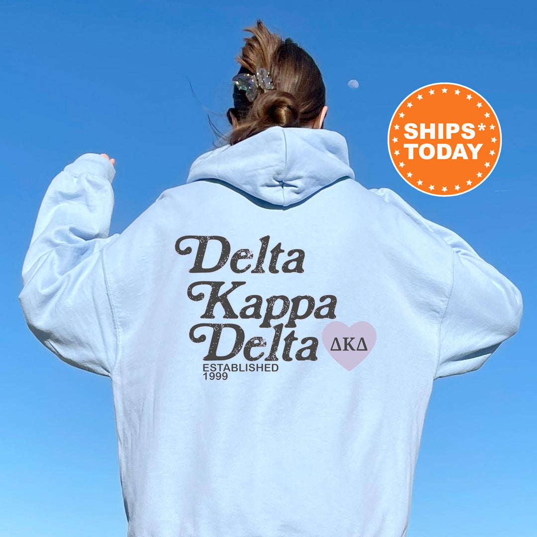 a woman wearing a white delta kapa delta hoodie