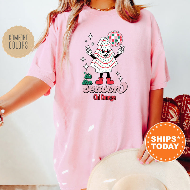 a woman wearing a pink shirt with a santa clause on it