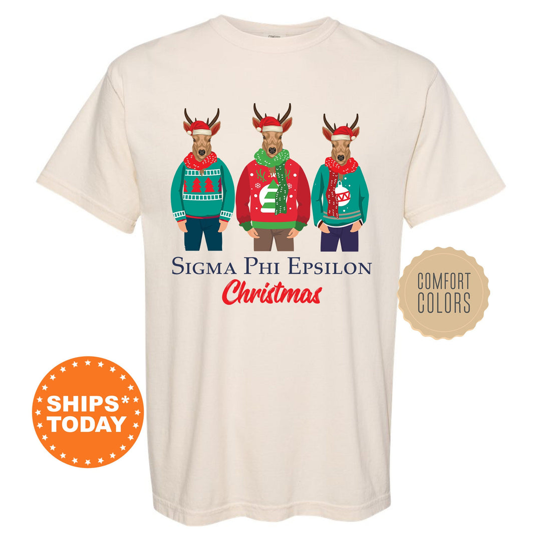 a white t - shirt with three reindeers wearing ugly sweaters