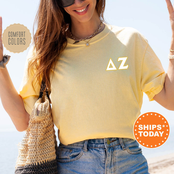 a woman in a yellow shirt holding up a peace sign