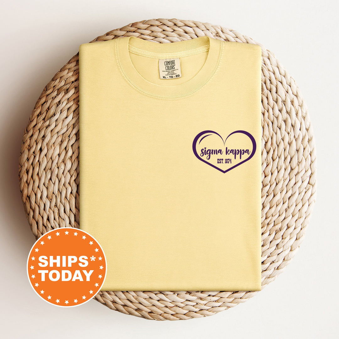 a yellow shirt with a purple heart on it