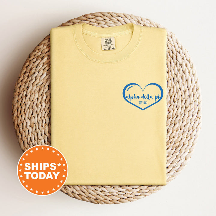 a yellow shirt with a blue heart on it