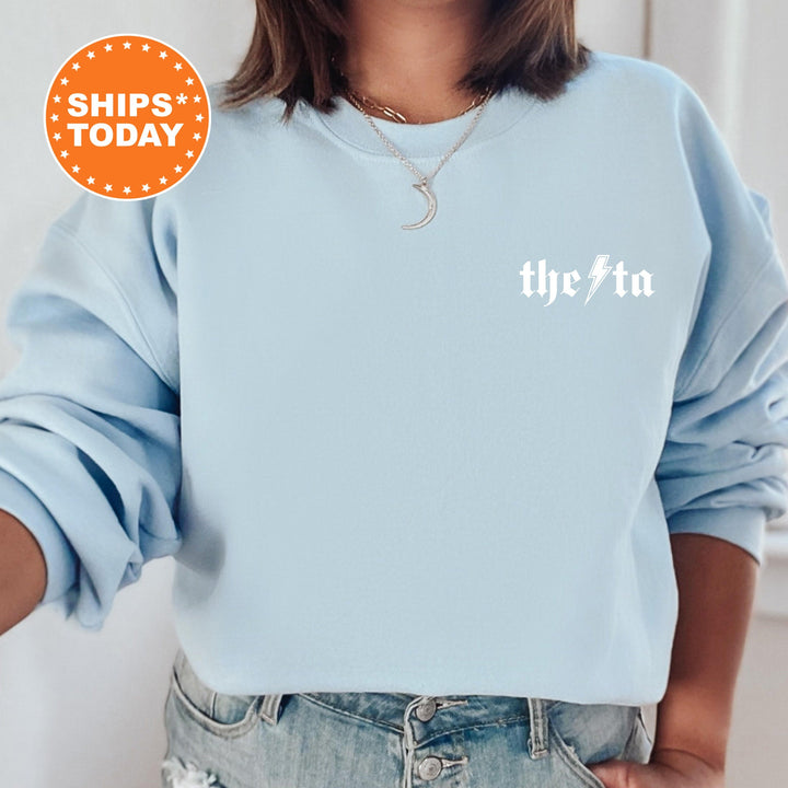 a woman wearing a blue sweatshirt with the word the inn printed on it