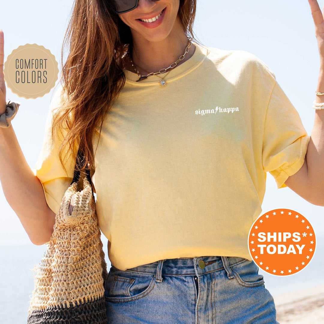 a woman in a yellow shirt holding up a peace sign