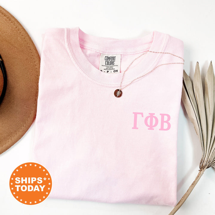 a hat, sunglasses, and a t - shirt on a table