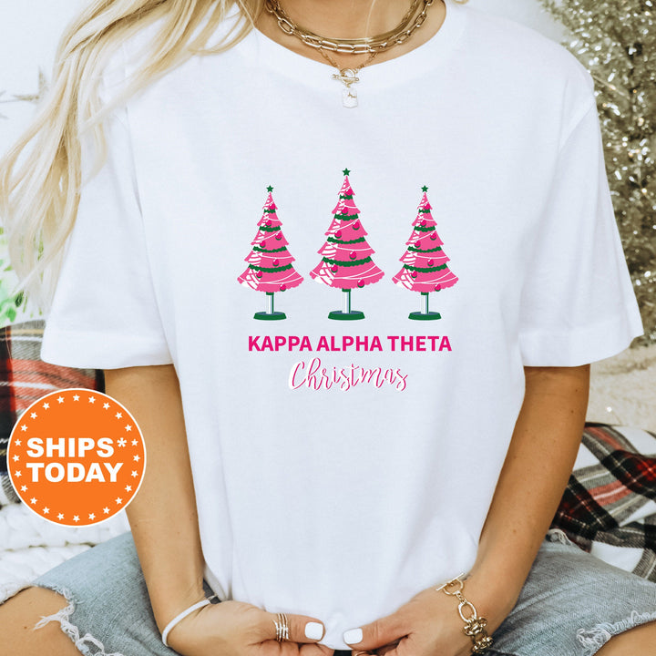 a woman wearing a t - shirt with three christmas trees on it