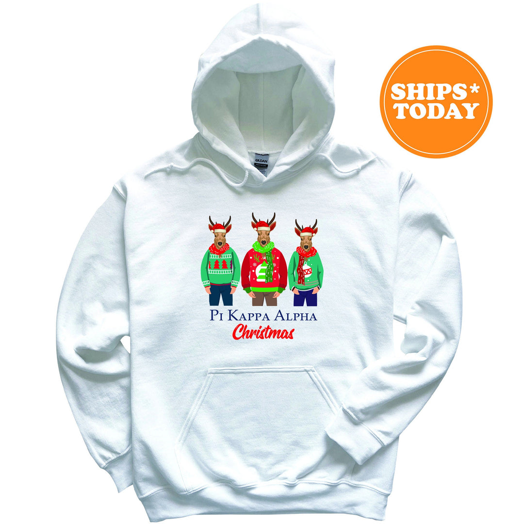 a white hoodie with three reindeers wearing ugly sweaters