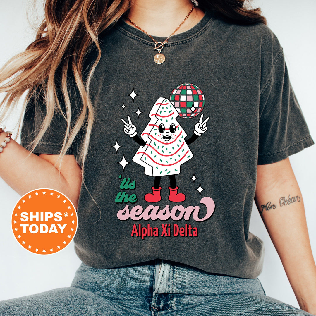 a woman wearing a black shirt with a santa clause on it