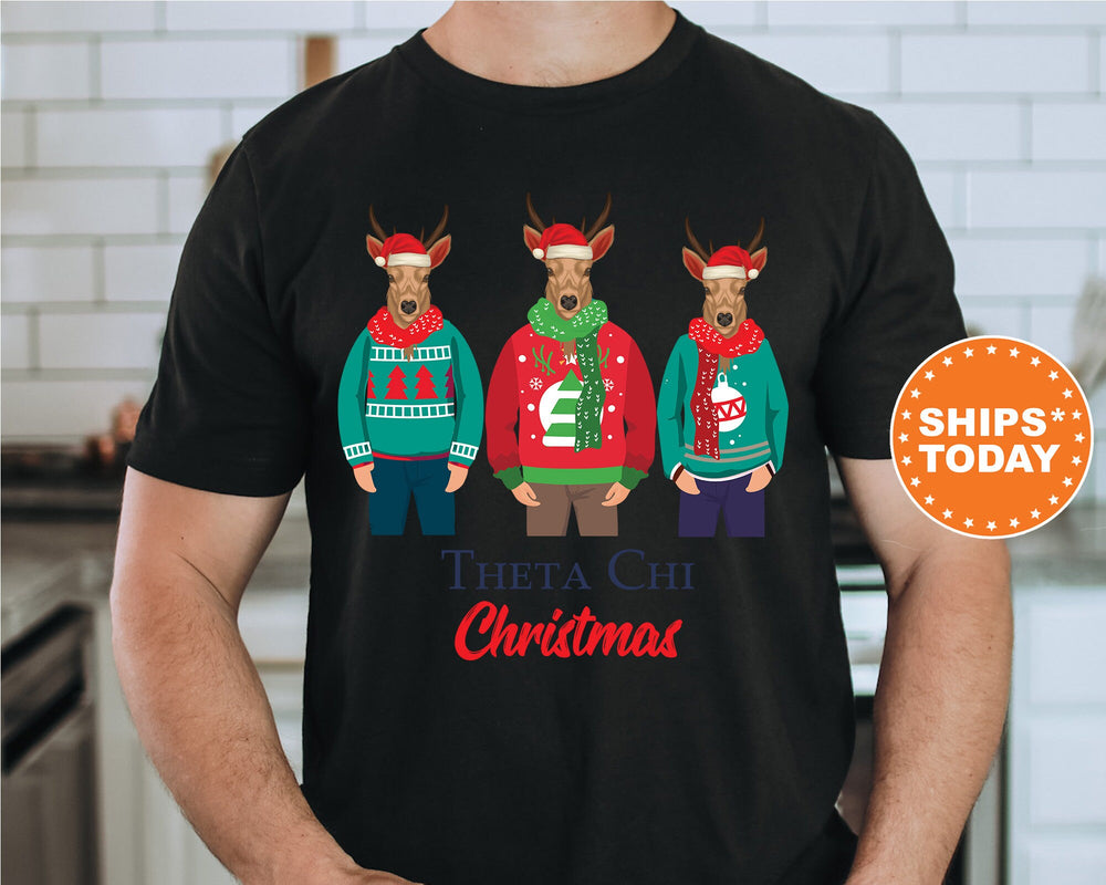 a man wearing a black t - shirt with three deer wearing ugly ugly sweaters