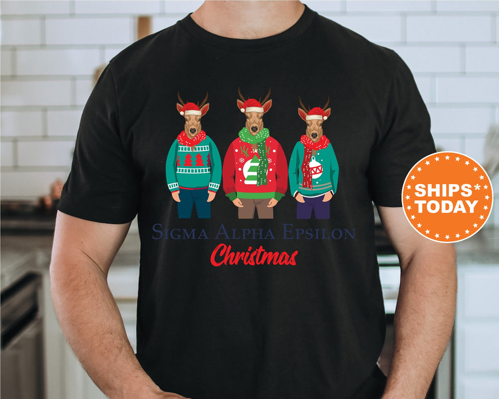 a man wearing a black shirt with three reindeers wearing ugly sweaters