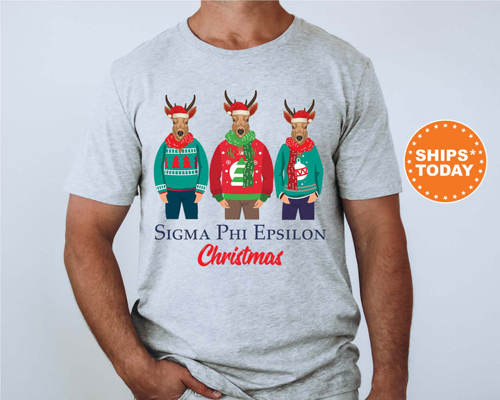 a man wearing a christmas shirt with three reindeers on it