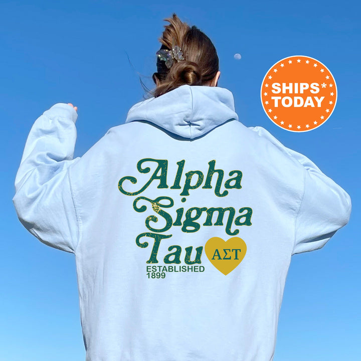 a woman wearing a white hoodie with the words aloha sigma tau act